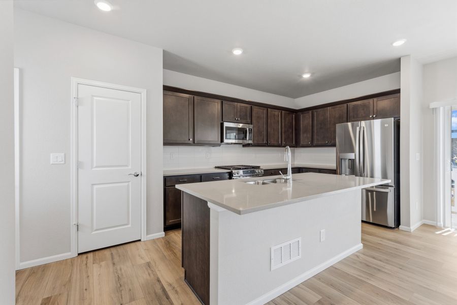 Furnished interior view inside a new home in Woodrose at Painted Prairie, Aurora (Image 3).