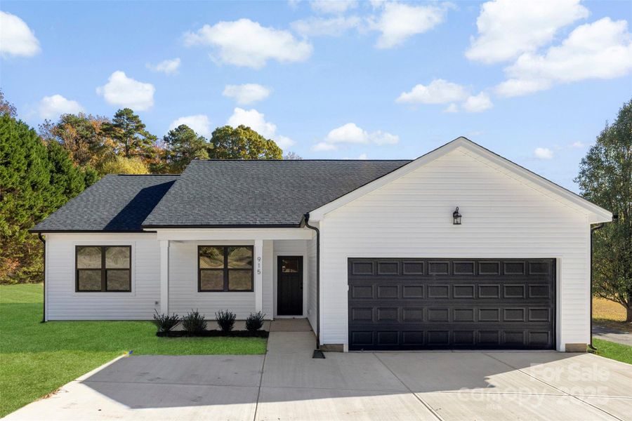 Front exterior of a new home in , Monroe, NC, highlighting curb appeal (Image 2).