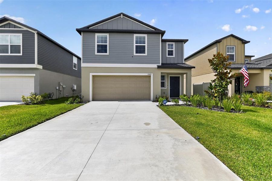 Front exterior of a new home in Prosperity Lakes, Parrish, FL, highlighting curb appeal (Image 1). Front exterior of a new home in Prosperity Lakes, Parrish, FL, highlighting curb appeal (Image 1).