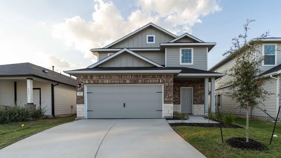 Front exterior of a new home in Sunset Oaks, Maxwell, TX, highlighting curb appeal (Image 1).