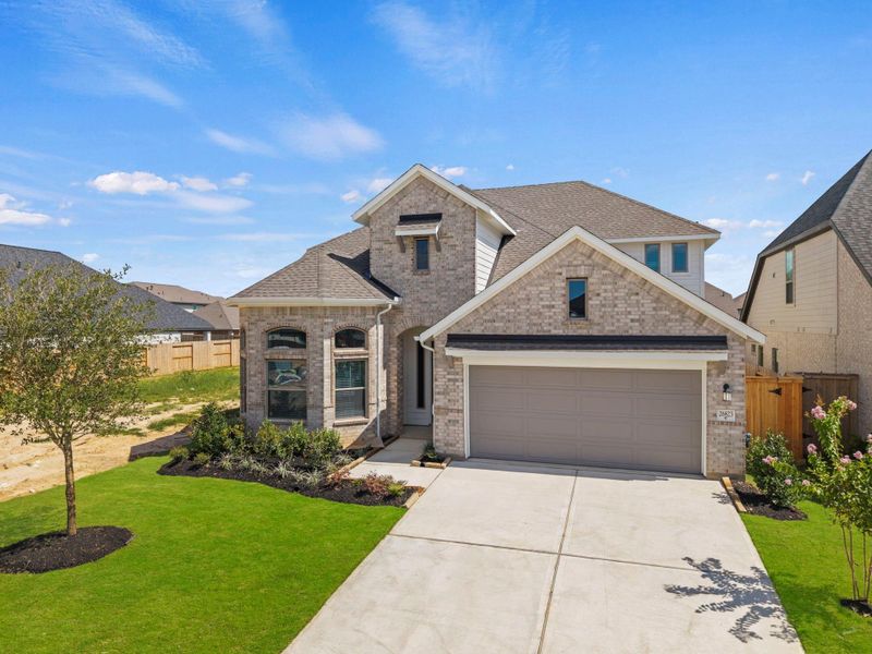 Front exterior of a new home in Candela, Richmond, TX, highlighting curb appeal (Image 22).