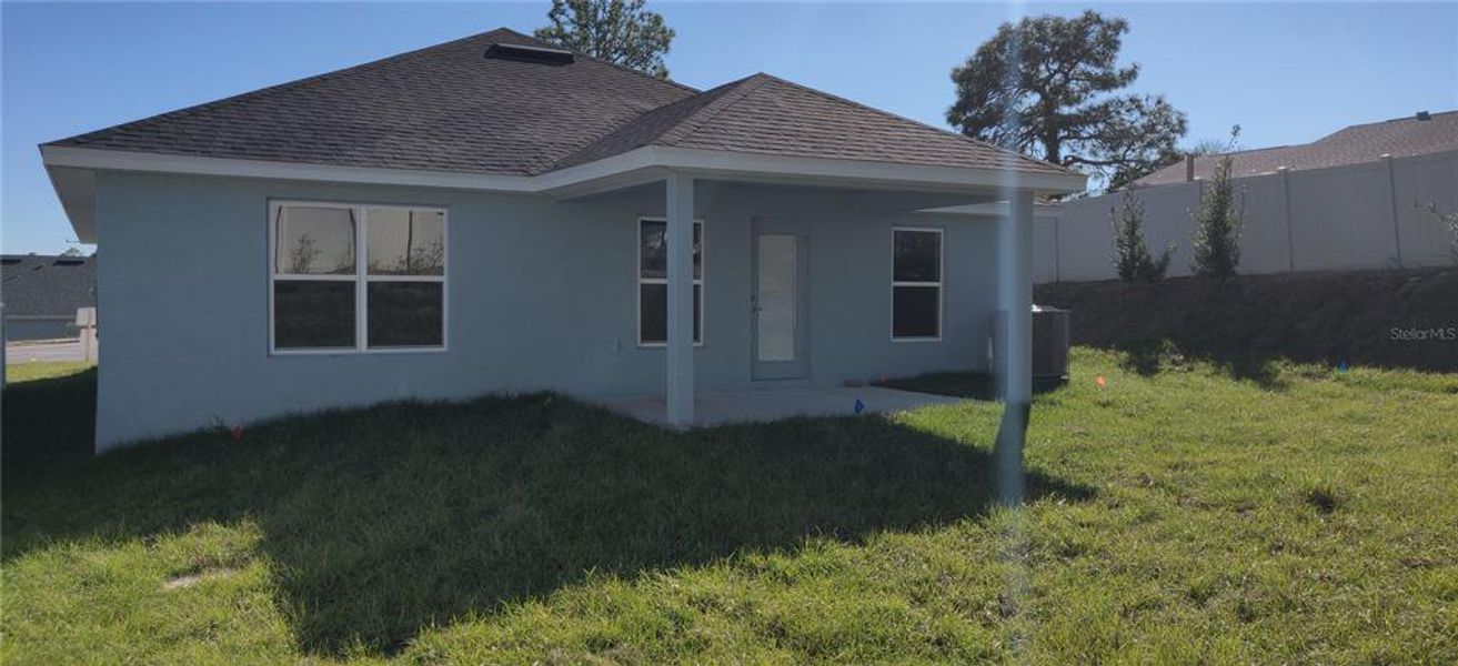 Exterior details and patio area of a home in Sunset Landing, Spring Hill (Image 8).