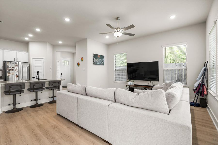 The seamless connection between the kitchen and living area creates a sense of openness that makes the home feel larger than its footprint, while still maintaining distinct spaces for gathering and relaxing.