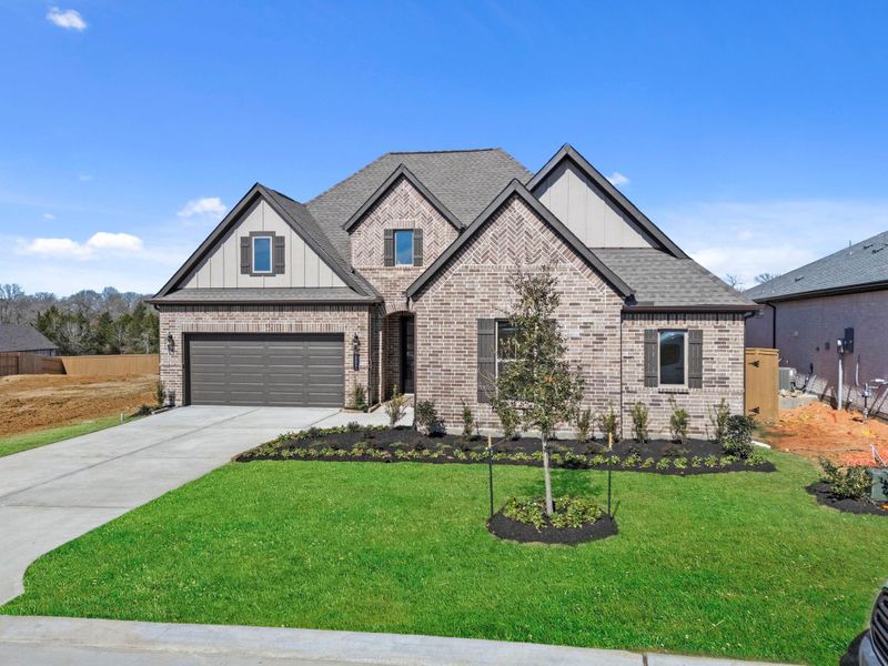 Front exterior of a new home in Chambers Creek, Willis, TX, highlighting curb appeal (Image 22).