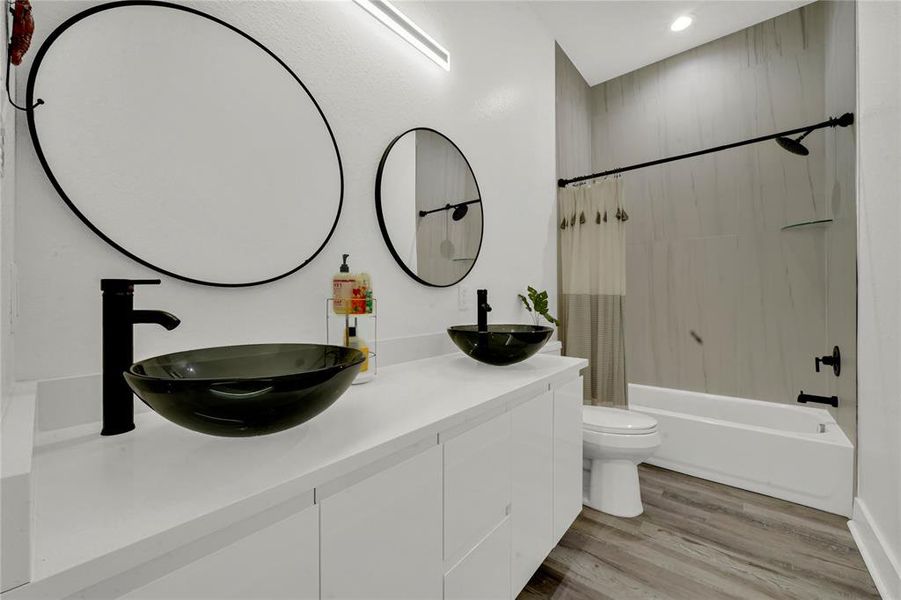 Secondary bathroom with dual vessel sinks