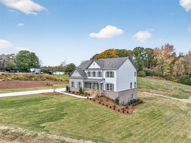 Front exterior of a new home in , Gainesville, GA, highlighting curb appeal (Image 32). Front exterior of a new home in , Gainesville, GA, highlighting curb appeal (Image 32).