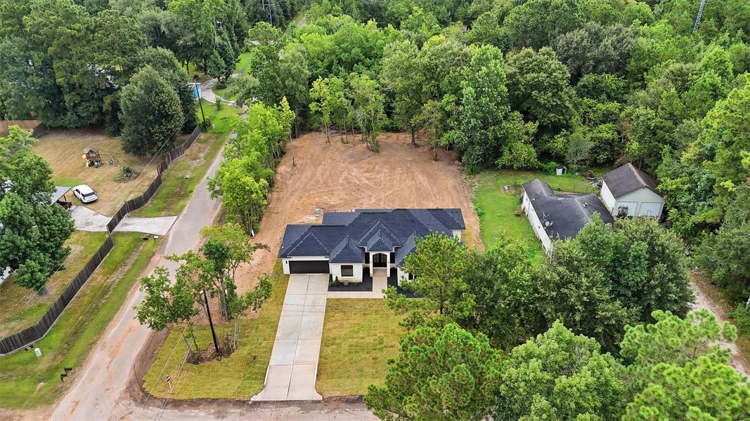 Front exterior of a new home in , Conroe, TX, highlighting curb appeal (Image 22).