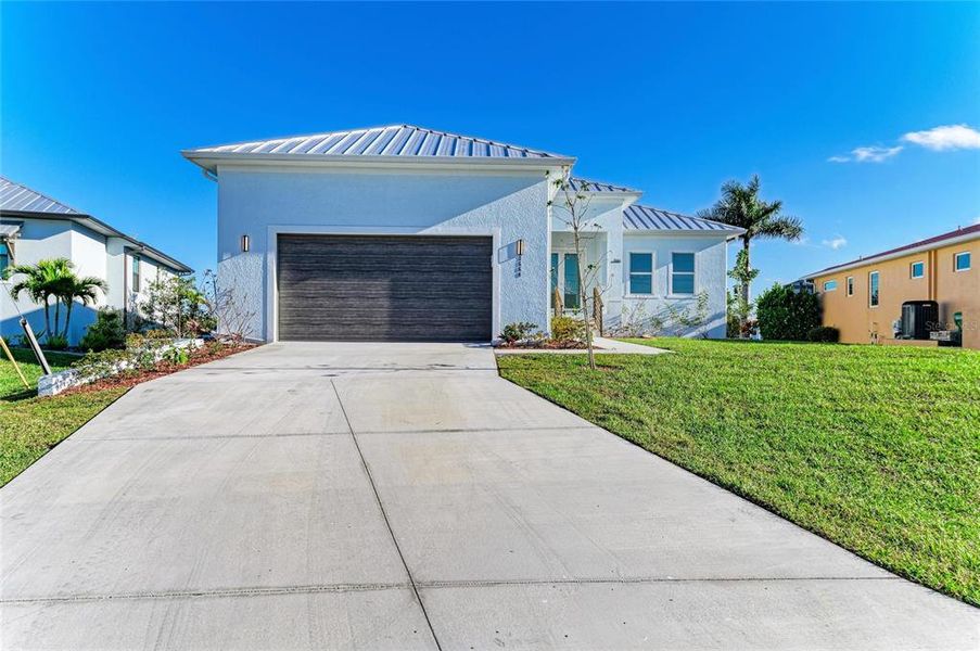 Front exterior of a new home in , Punta Gorda, FL, highlighting curb appeal (Image 29).