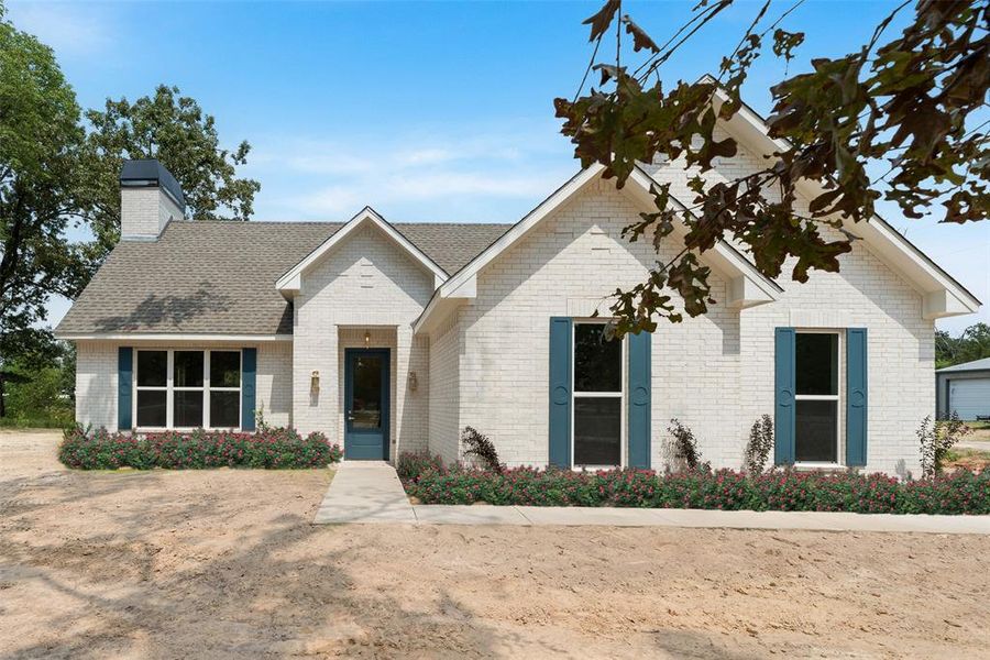 Roses in the photo are a visual representation and not physically present on the property.