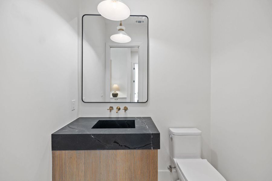 Bathroom featuring vanity and toilet Bathroom featuring vanity and toilet