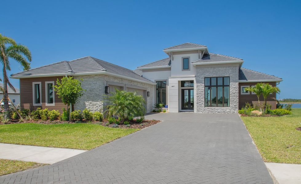 Front exterior of a new home in Palmera, Venice, FL, highlighting curb appeal (Image 2).