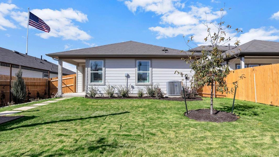 Front exterior of a new home in Prairie Lakes, Buda, TX, highlighting curb appeal (Image 1).
