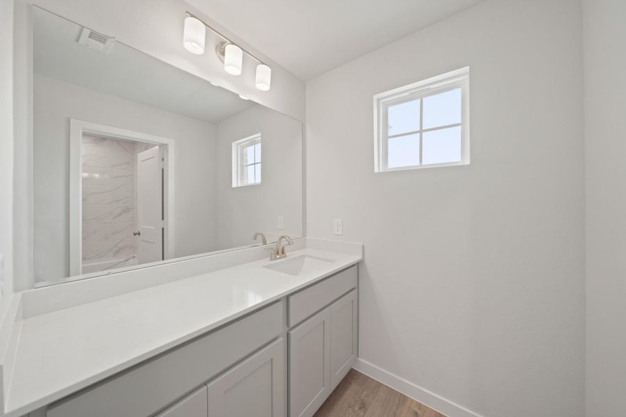 Furnished interior view inside a new home in Sunterra, Katy (Image 7).