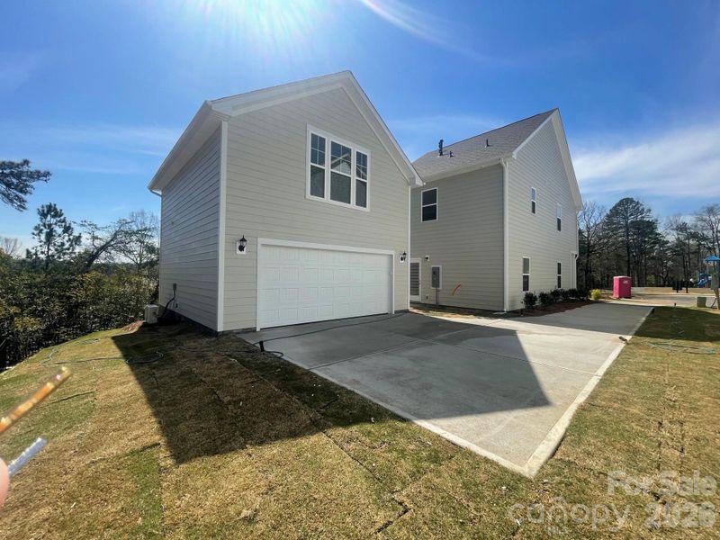 Rear Detached, 2 car garage with finished bonus above complete with full bath, wetbar and walk in storage