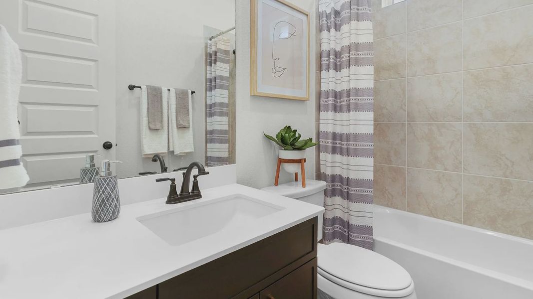 Representative furnished interior of a home built from the Brooks by Chesmar Homes in University Heights, Round Rock (Image 6).