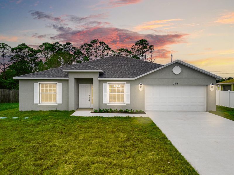 Front exterior of a new home in , Vero Beach, FL, highlighting curb appeal (Image 1).