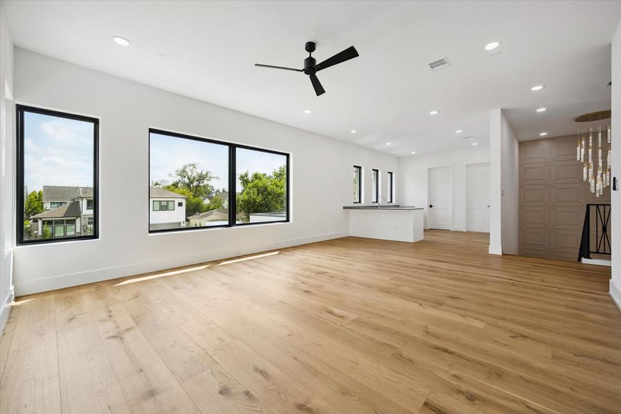 One of a kind game/media room, features a large wet bar and abundant natural light. This is the perfect area for family and friends gathering. One of a kind game/media room, features a large wet bar and abundant natural light. This is the perfect area for family and friends gathering.