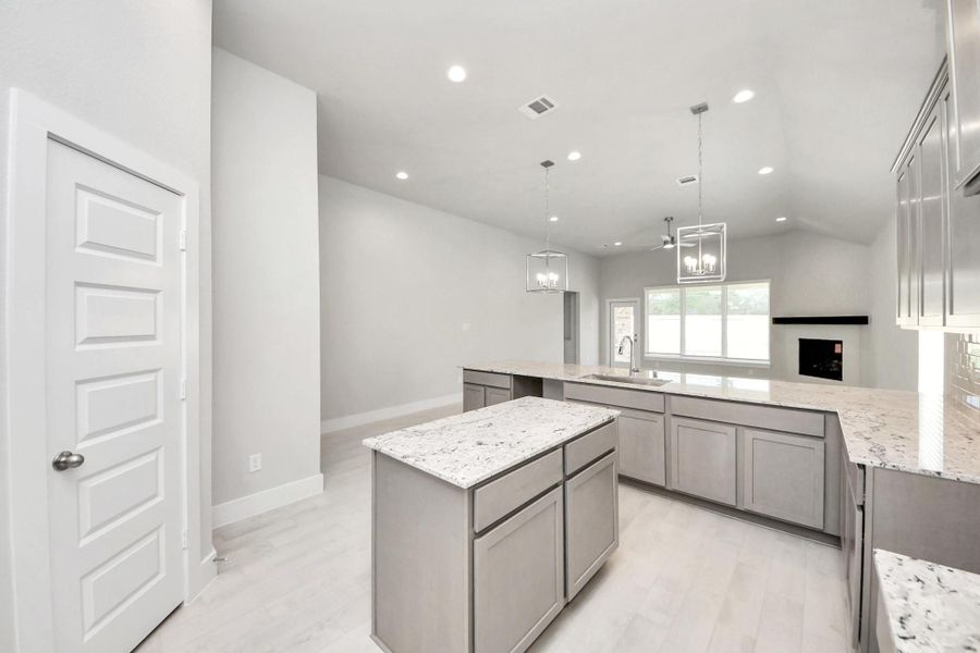 This generously spacious kitchen is a dream realized! Sample photo of completed home with similar floor plan. Actual colors and selections may vary.