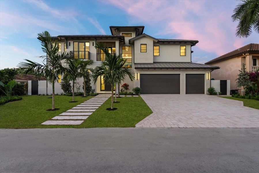 Front exterior of a new home in , Delray Beach, FL, highlighting curb appeal (Image 1). Front exterior of a new home in , Delray Beach, FL, highlighting curb appeal (Image 1).