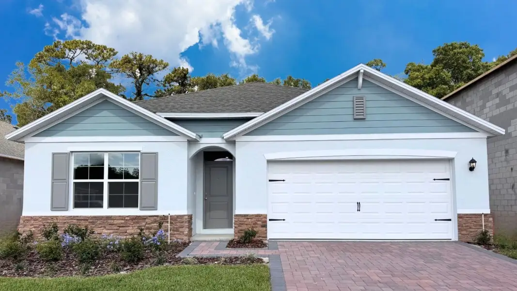 Front exterior of a new home in Sagewood, Apopka, FL, highlighting curb appeal (Image 1). Front exterior of a new home in Sagewood, Apopka, FL, highlighting curb appeal (Image 1).