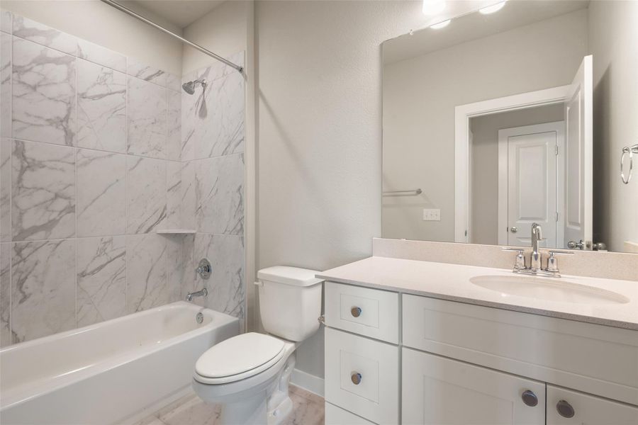 Full bath with vanity and shower / washtub combination