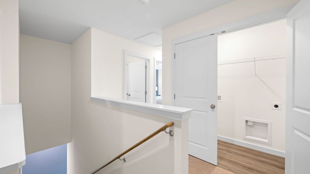 Representative furnished interior of a home built from the Mitchell Townhome by D.R. Horton in Belcourt Landing, Cleveland (Image 22).