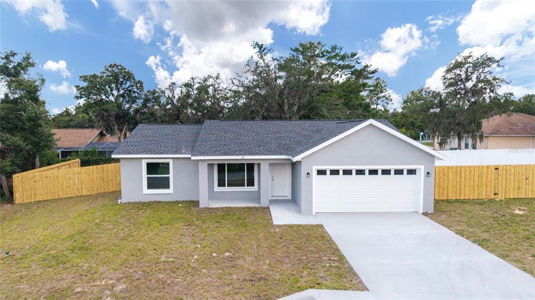 Front exterior of a new home in , Ocklawaha, FL, highlighting curb appeal (Image 18).