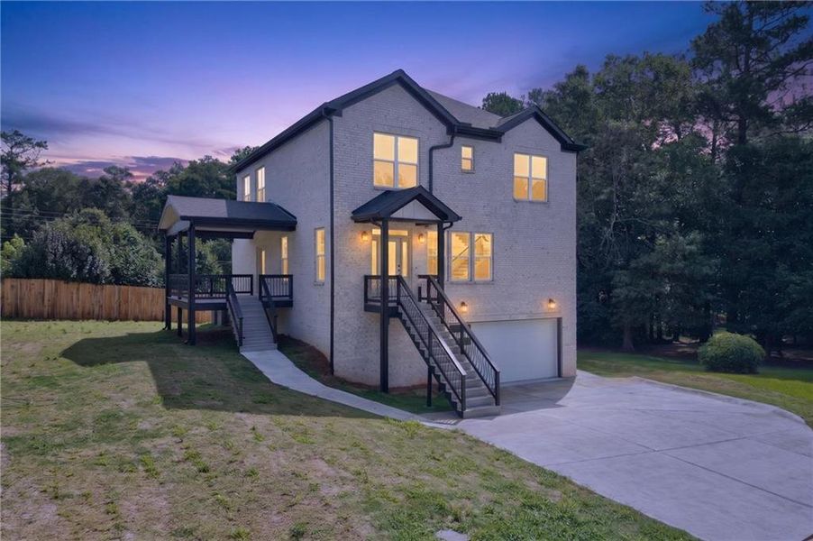 Front exterior of a new home in , Loganville, GA, highlighting curb appeal (Image 24). Front exterior of a new home in , Loganville, GA, highlighting curb appeal (Image 24).