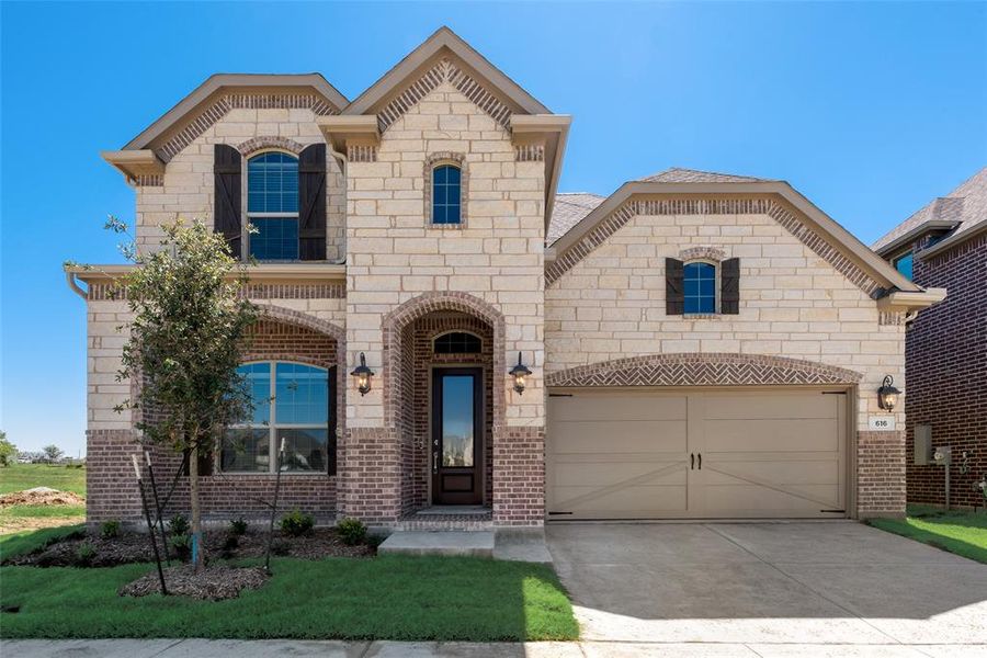 View of front of property with a garage