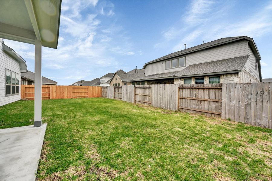 Exterior details and patio area of a home in Canterra Creek  60', Iowa Colony (Image 28).