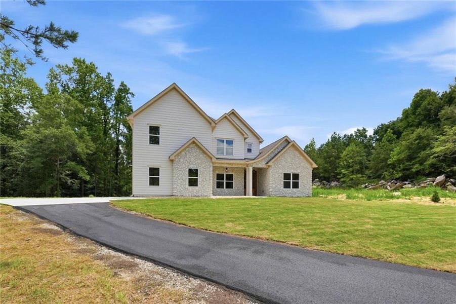 Front exterior of a new home in , Douglasville, GA, highlighting curb appeal (Image 2). Front exterior of a new home in , Douglasville, GA, highlighting curb appeal (Image 2).