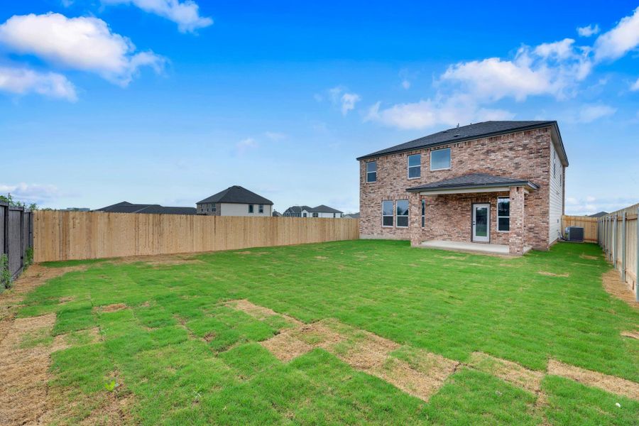 Front exterior of a new home in Overlook Ranch, Georgetown, TX, highlighting curb appeal (Image 23).