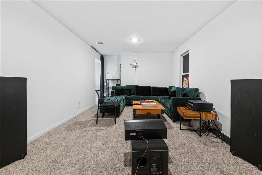 Living room featuring light colored carpet