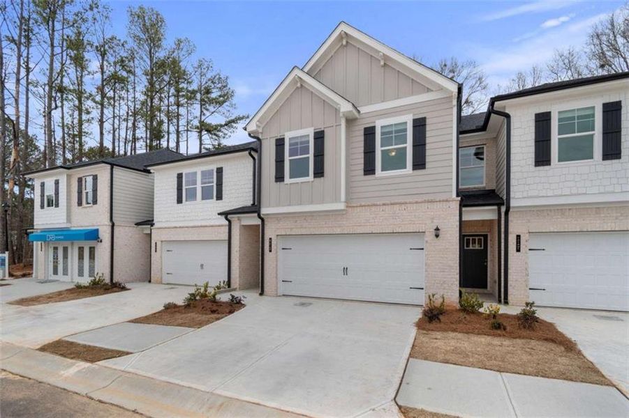 Front exterior of a new home in Diamante, Stockbridge, GA, highlighting curb appeal (Image 21).