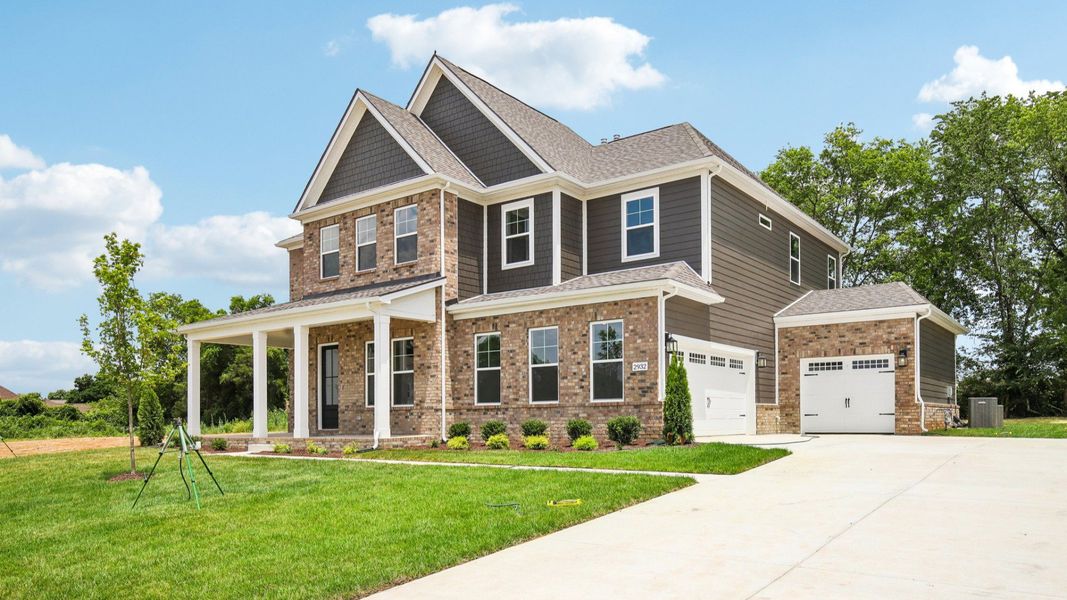 Exterior with covered front porch and side-entry garage Exterior with covered front porch and side-entry garage