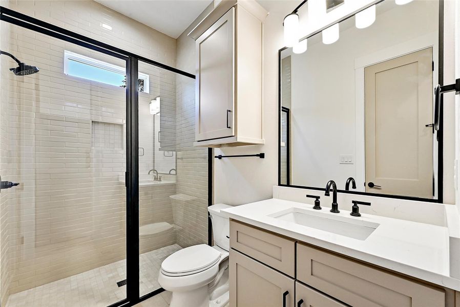 This beautiful full bath is off one of the secondary bedrooms in the rear of the home.
