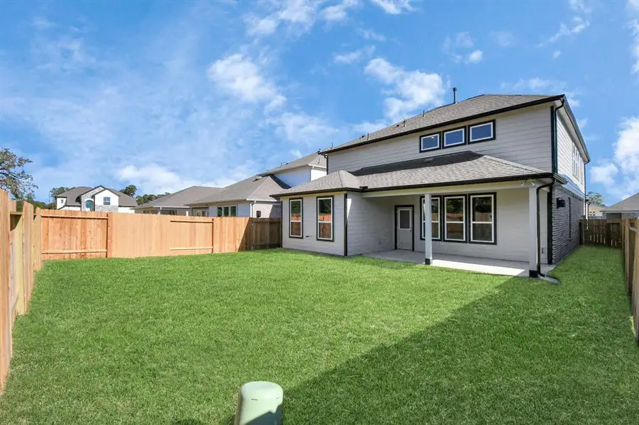 Welcome to this backyard retreat, offering an abundance of space for kids to play and explore. The possibilities are endless in this outdoor haven, where the joy of open-air activities and family gatherings awaits.