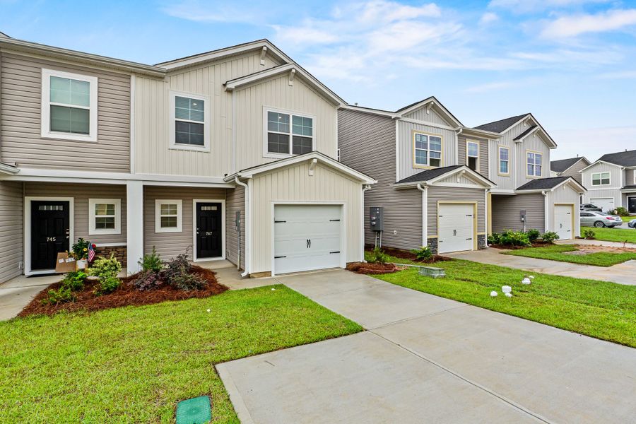 Front exterior of a new home in Hunters Branch Townhomes, Hopkins, SC, highlighting curb appeal (Image 2).