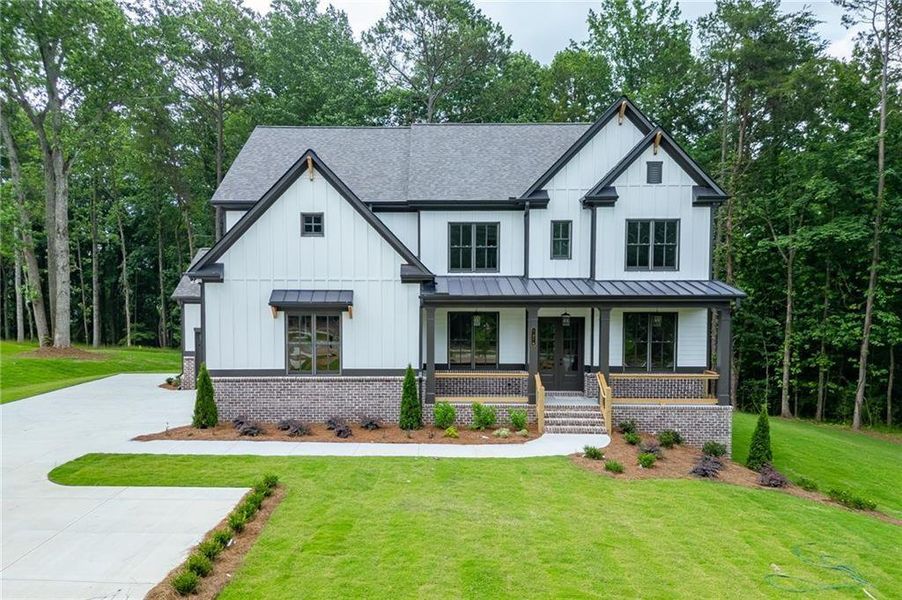 Front exterior of a new home in , Cumming, GA, highlighting curb appeal (Image 26). Front exterior of a new home in , Cumming, GA, highlighting curb appeal (Image 26).