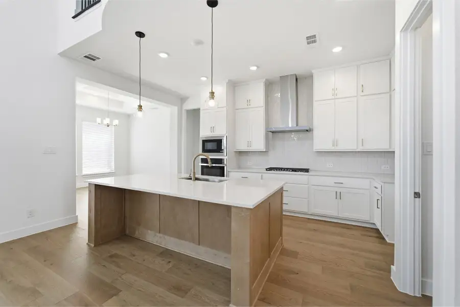 Furnished interior view inside a new home in Green Meadows, Celina (Image 9).