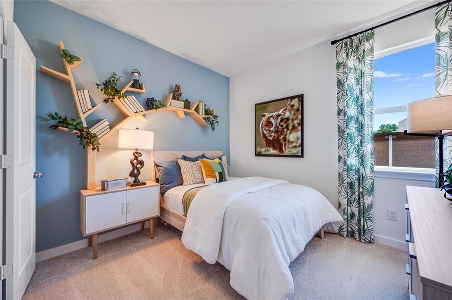 Carpeted bedroom with multiple windows