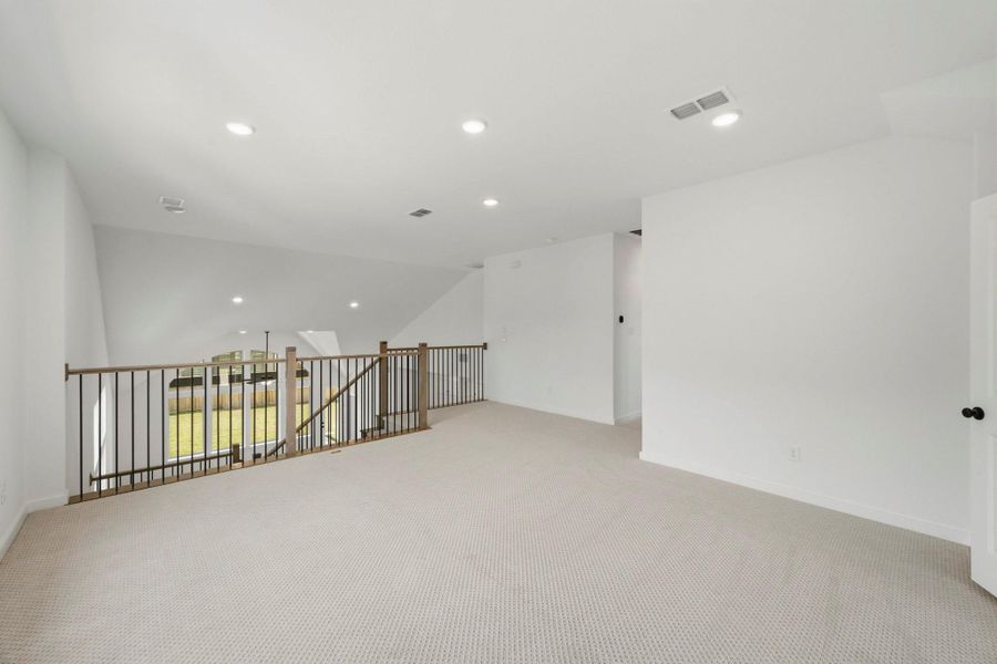 Open-To-Below View Showcasing The High Ceilings And Open Railings Open-To-Below View Showcasing The High Ceilings And Open Railings
