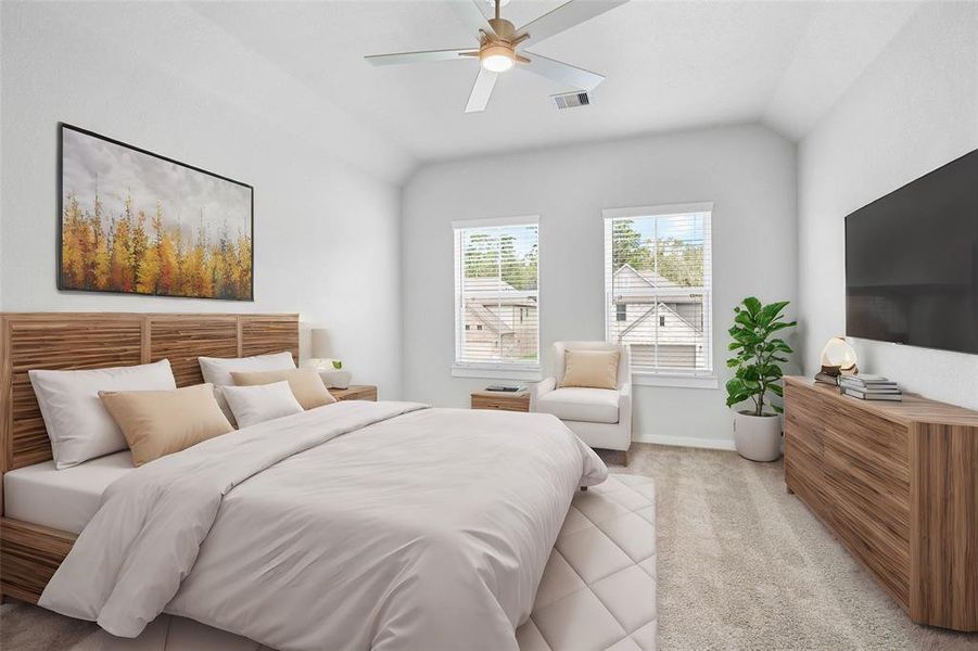 Secondary bedroom features plush carpet, custom paint, ceiling fan with lighting and a large windows with privacy blinds.