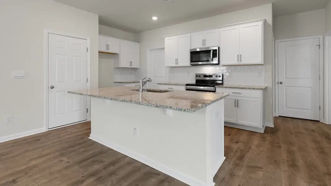 Furnished interior view inside a new home in The Grove at Matthews Landing, Fuquay Varina (Image 4).
