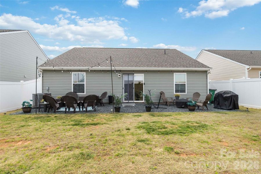 Exterior details and patio area of a home in McKee Creek Village, Charlotte (Image 26).