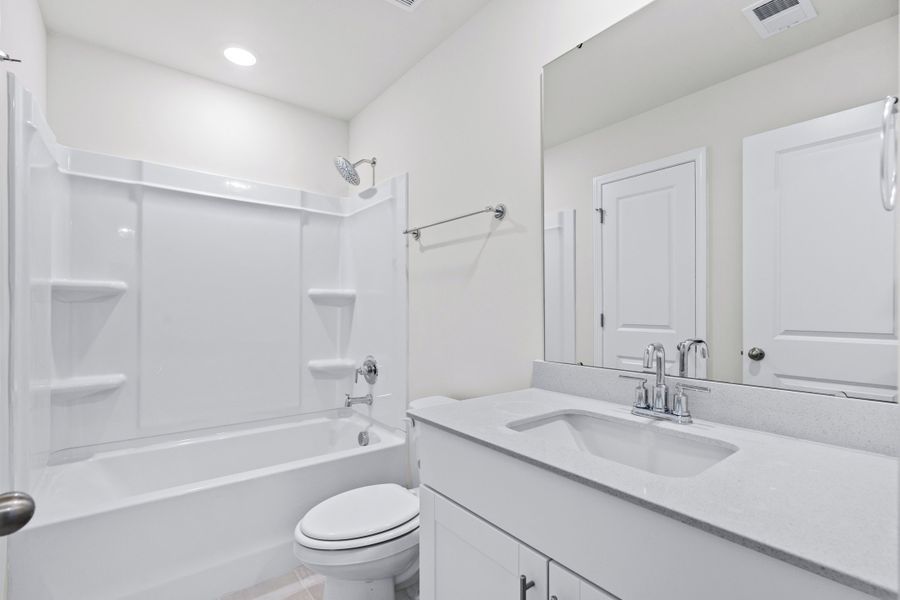 A full bathroom is located next to the secondary bedrooms. A full bathroom is located next to the secondary bedrooms.
