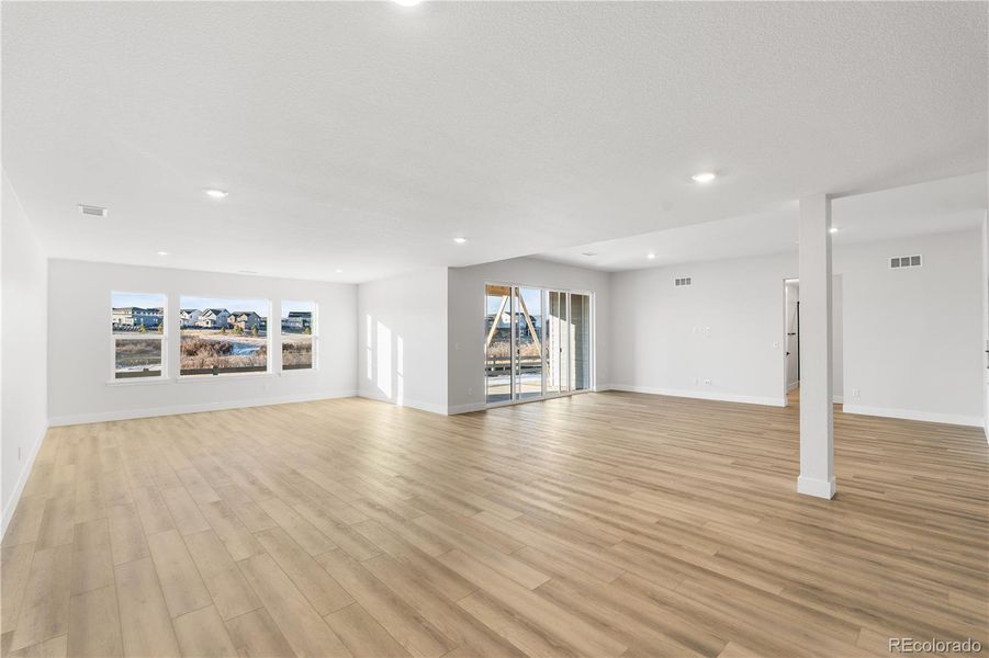 Spacious, unfurnished interior of a new home in Luxe at The Canyons, Castle Pines (Image 35).