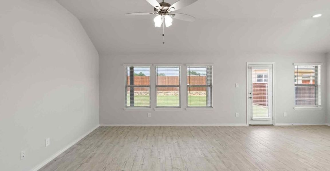 Representative exterior photo of a completed home built from the Atlanta by Impression Homes in Keeneland, Aubrey, TX (Image 9).