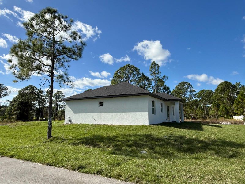 Exterior details and patio area of a home in , Lehigh Acres (Image 2). Exterior details and patio area of a home in , Lehigh Acres (Image 2).