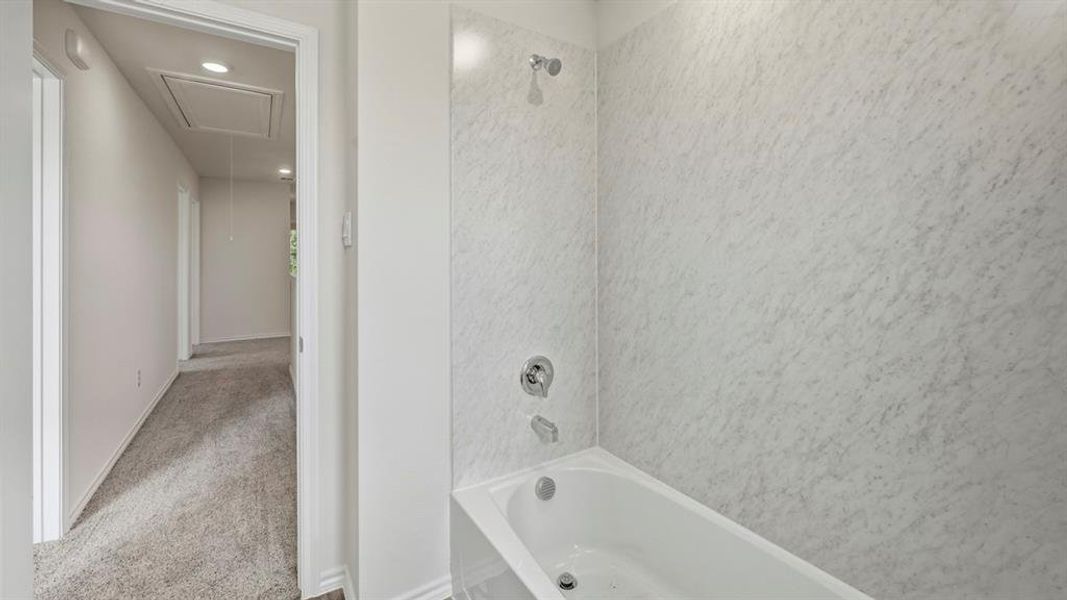 Full bath featuring bathtub / shower combination and carpet